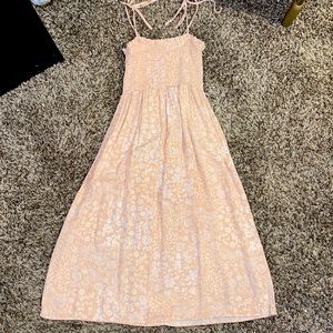 Light Pink floral sun dress with tie shoulder straps.